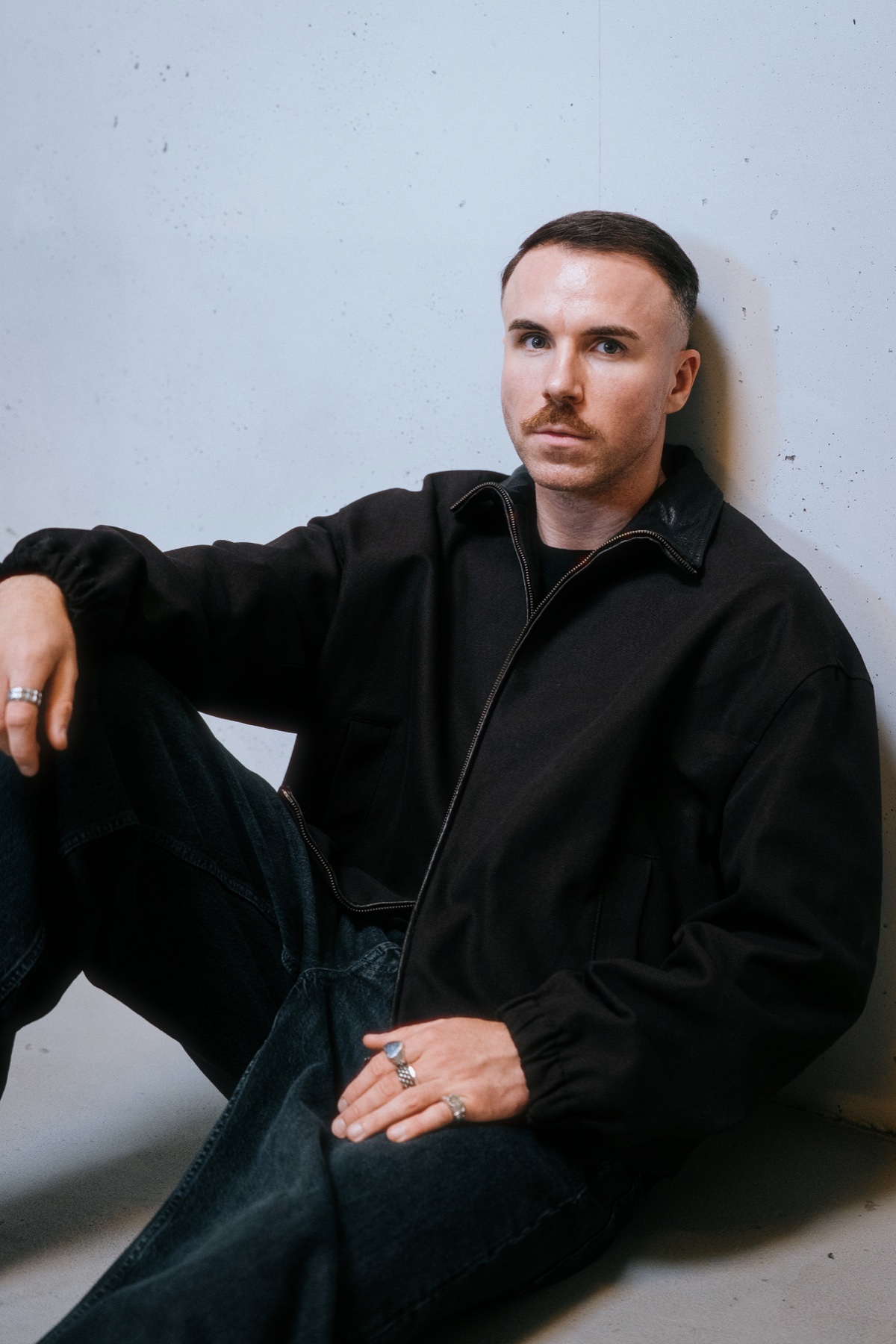 Nik Andersson seated editorial portrait