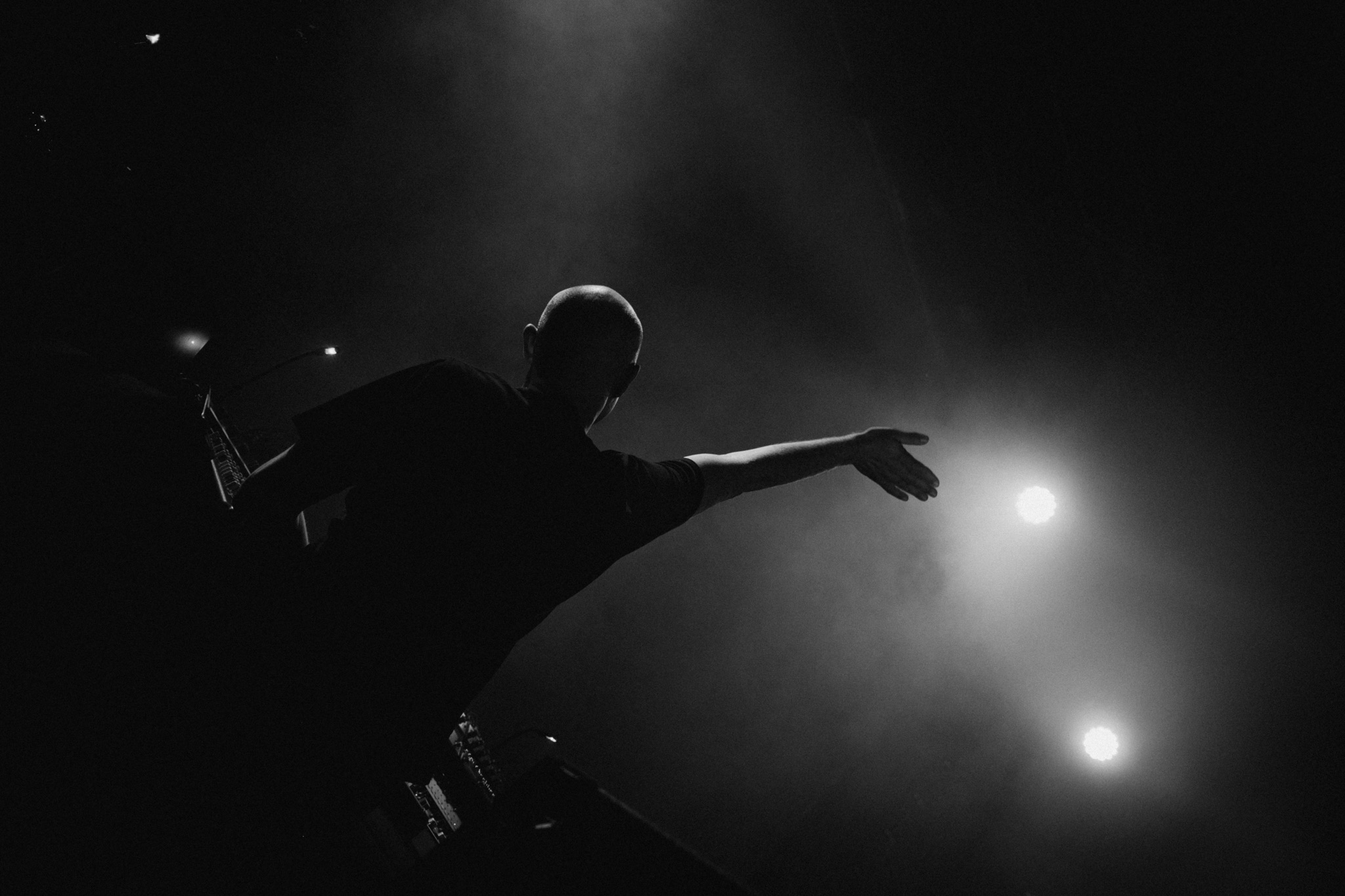 Paul Kalkbrenner silhouetted on stage
