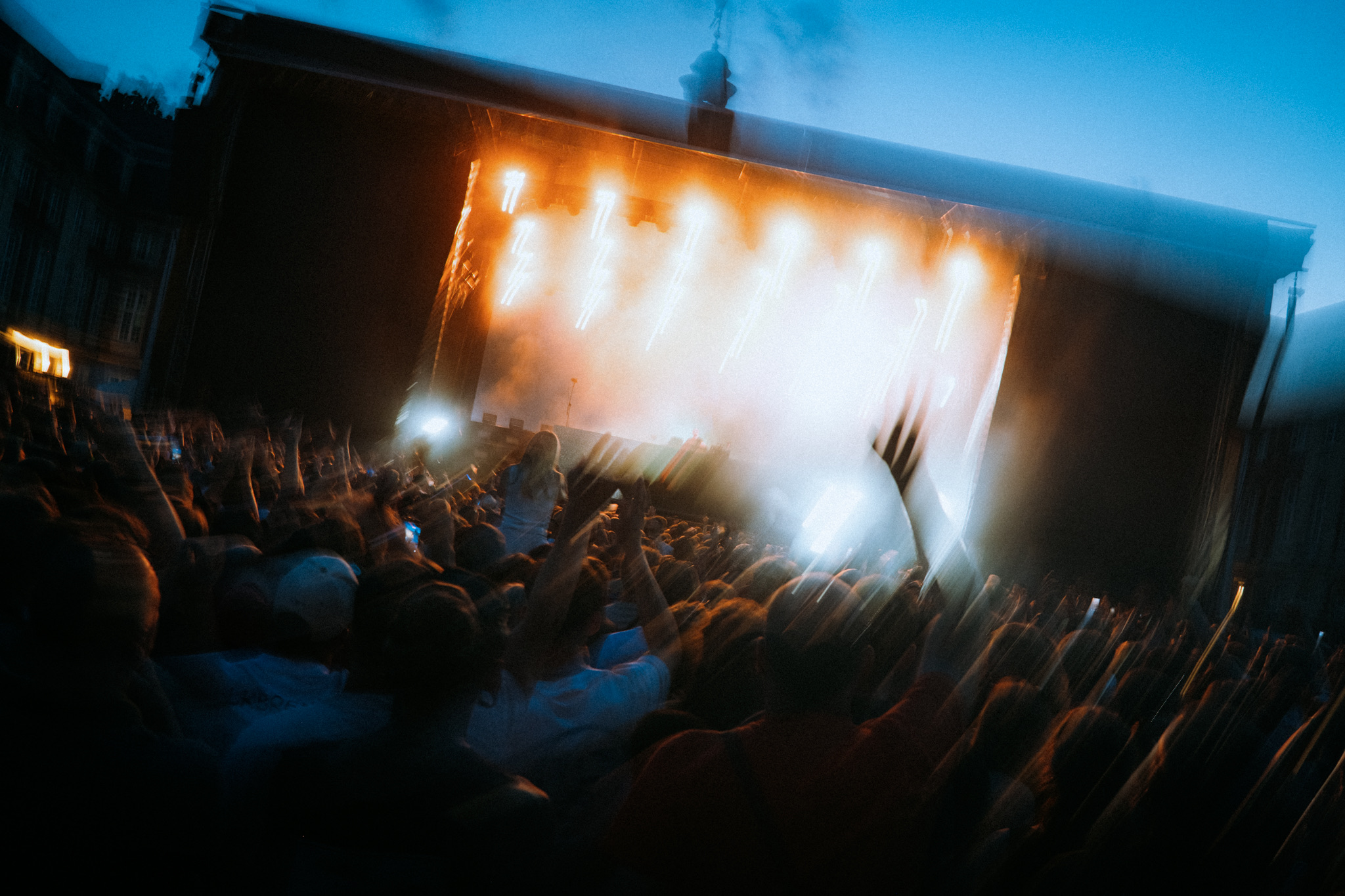 Festival stage lights and crowd during Paul Kalkbrenner's set